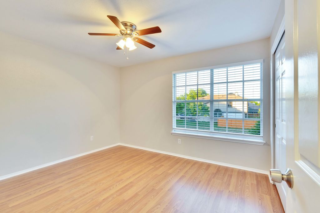 3201 Mocha Trail Austin, TX 78728 - Photo 23 of 26 an empty room with wooden floor and windows