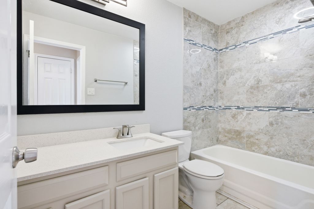 3201 Mocha Trail Austin, TX 78728 - Photo 24 of 26 a bathroom with a sink a toilet and a bathtub