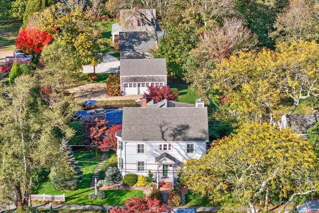 an aerial view of a house with swimming pool and outdoor space