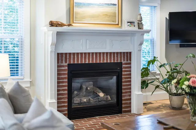 a bed room with a bed and a chair