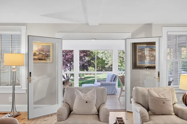 a bed sitting in a bedroom next to a lamp