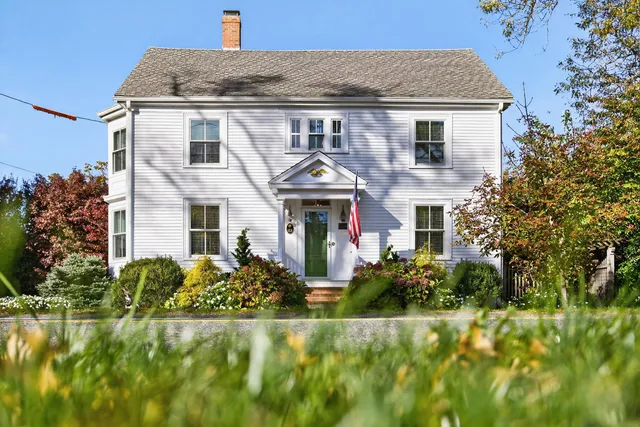 an aerial view of a house with a yard and garden