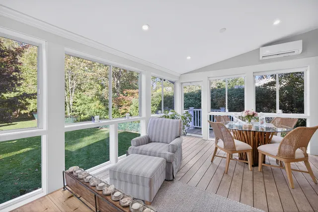 a white bath tub sitting next to a window