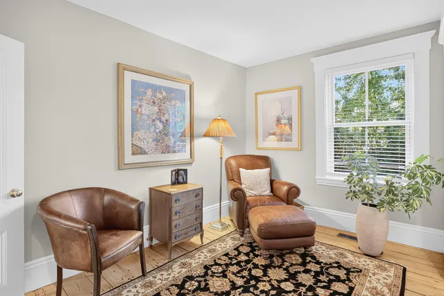 a bedroom with a bed and a lamp on table