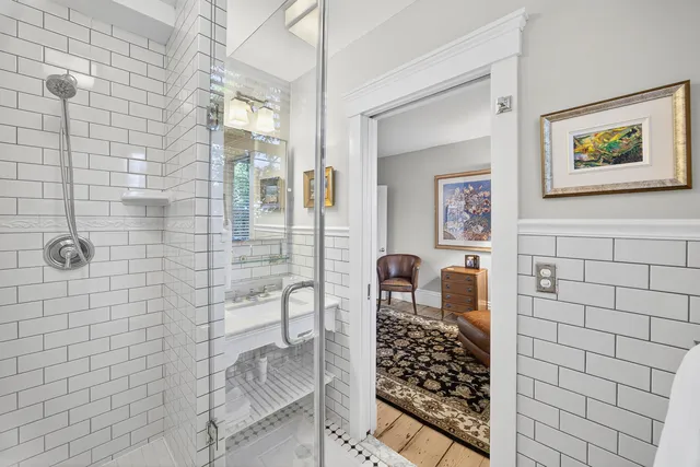 a view of staircase with white walls and a window