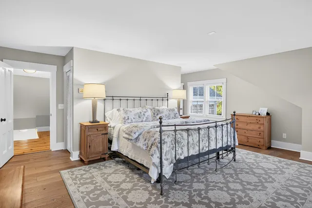 an aerial view of a house with a yard and garden