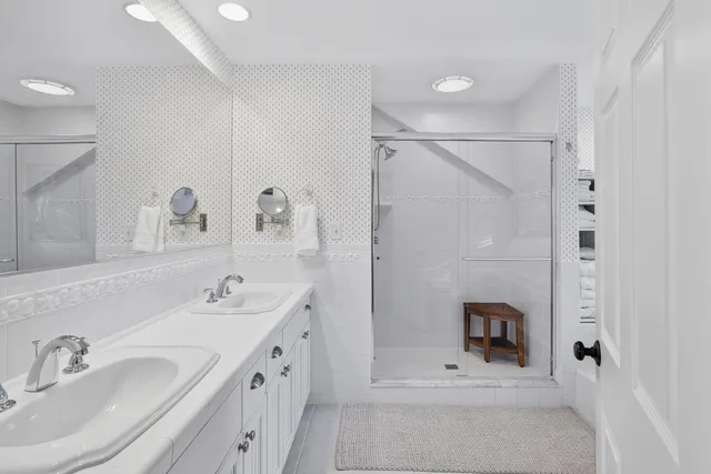 a view of a tables and chairs under an umbrella in patio