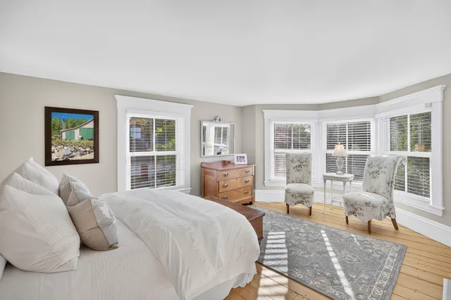 a view of balcony with wooden floor and outdoor seating