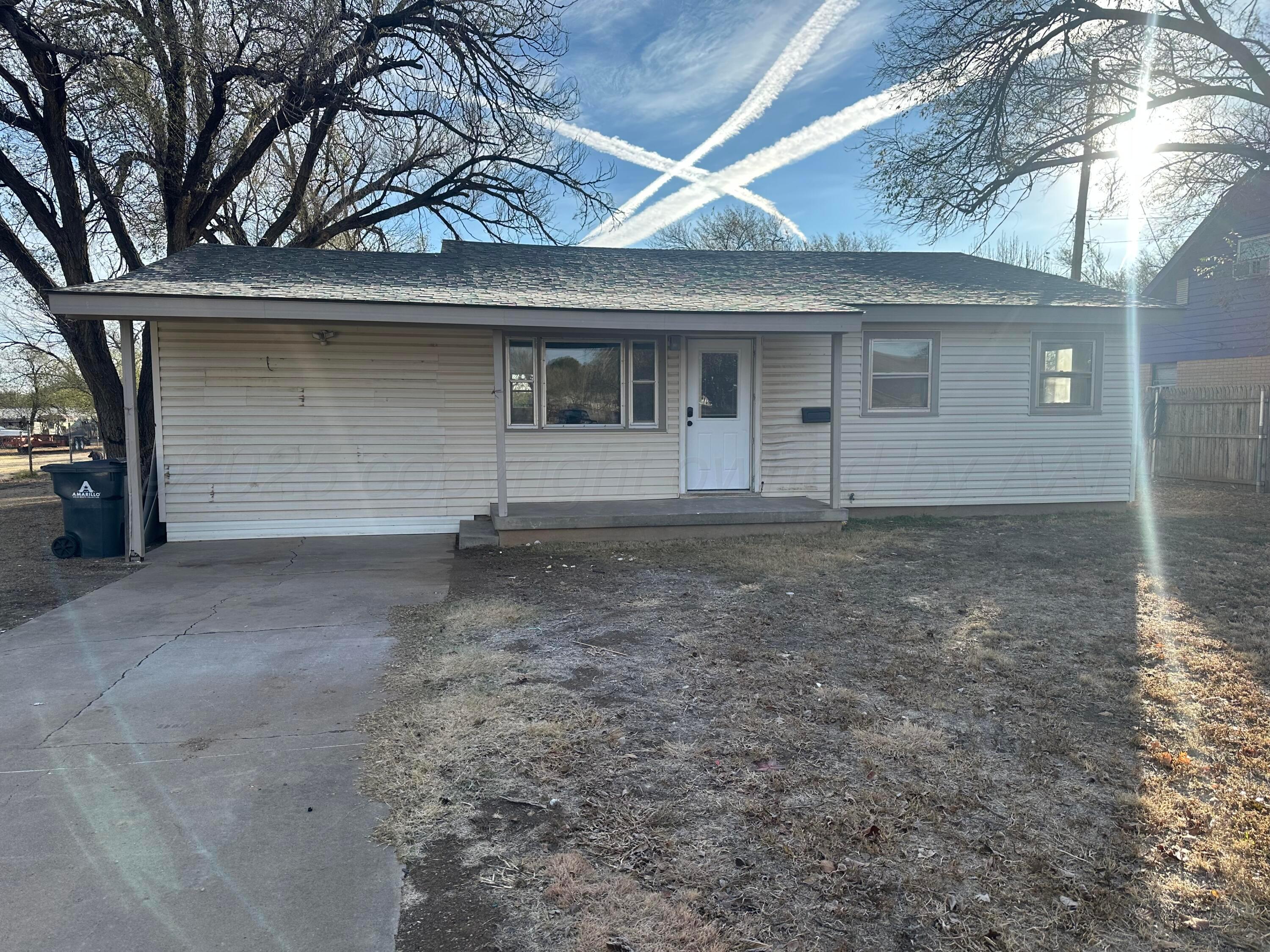 4854 Morning Drive Amarillo, TX 79108 - Photo 11 of 22 a view of a house with a yard