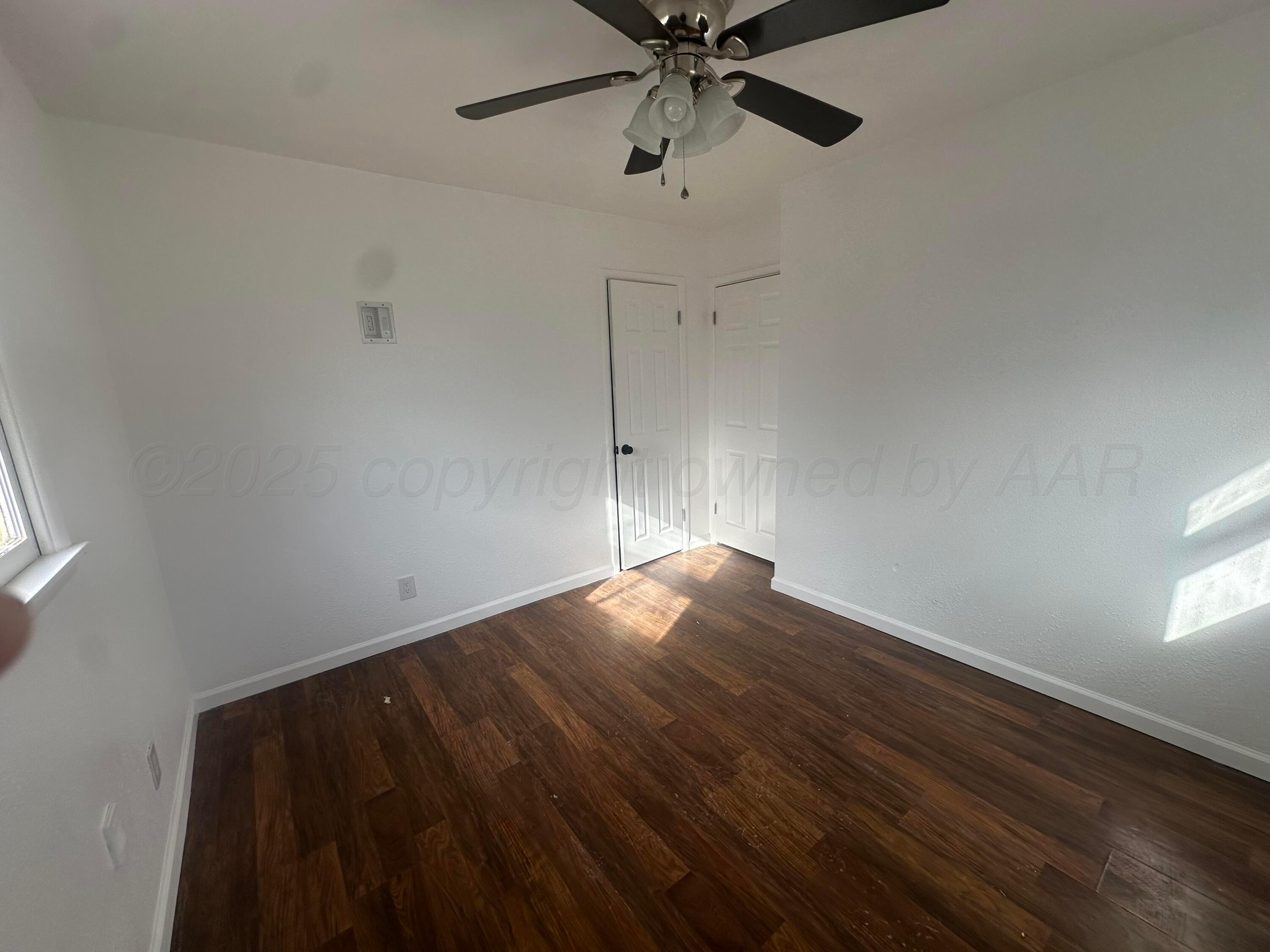 4854 Morning Drive Amarillo, TX 79108 - Photo 14 of 22 a view of empty room with wooden floor