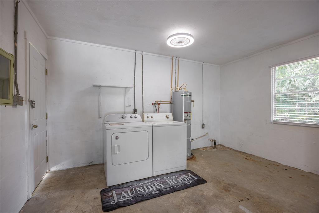 113 Browns Road San Mateo, FL 32187 - Photo 26 of 36 a room with a washing machine and a sink