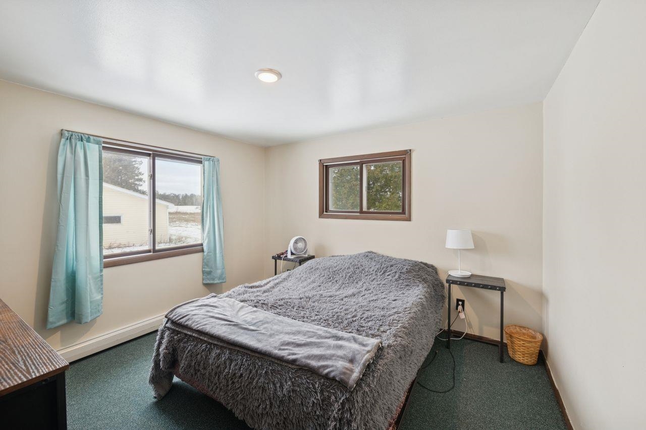 60609 Argo Road Mason, WI 54856 - Photo 13 of 29 Carpeted bedroom featuring baseboards and baseboard heating