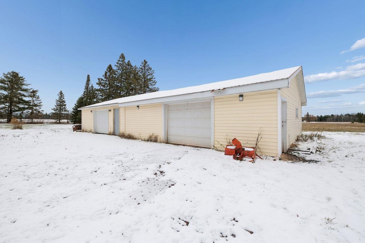 60609 Argo Road Mason, WI 54856 - Photo 18 of 29 Snow covered garage with a detached garage