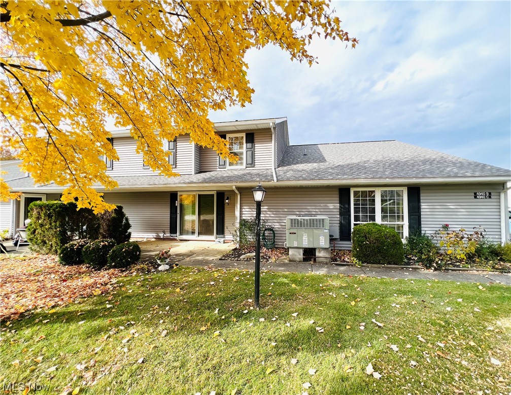 4940 Friar Road, Unit B Stow, OH 44224 - Photo 32 of 33 Front facade with a front yard and central AC unit