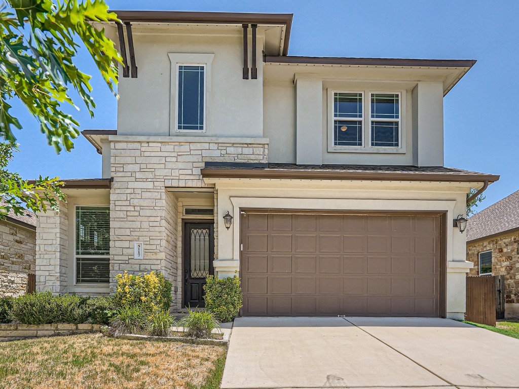 5117 Rain Lily Drive Austin, TX 78739 - Photo 1 of 1 a front view of a house with garden