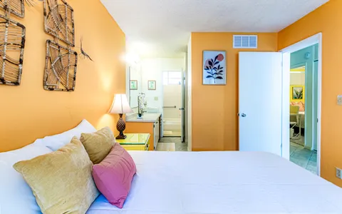 a bedroom with a bed and couch