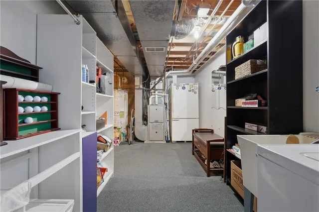 a view of a patio with a table and chairs