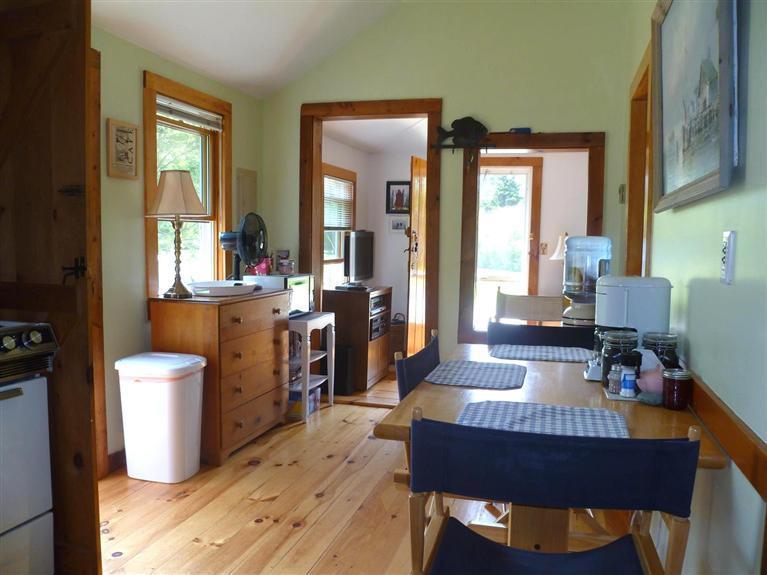 56 Hay Road, Unit 56 Eastham, MA 02642 - Photo 4 of 21 a dining room with furniture and wooden floor