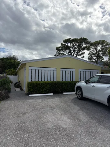 a view of houses with yard and entertaining space