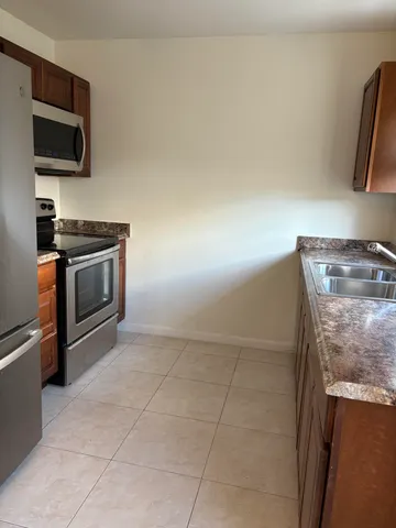 a kitchen with a stove and a microwave