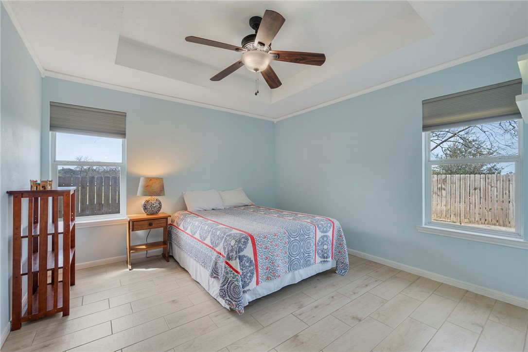 501 Riggs Street Brenham, TX 77833 - Photo 11 of 22 a bed room with a bed and a window