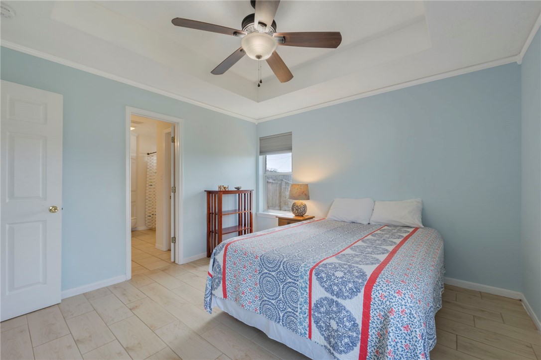 501 Riggs Street Brenham, TX 77833 - Photo 12 of 22 a bedroom with a bed and a ceiling fan