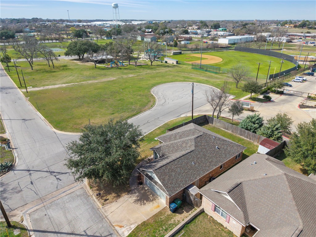 501 Riggs Street Brenham, TX 77833 - Photo 3 of 22 an aerial view of a house with a swimming pool