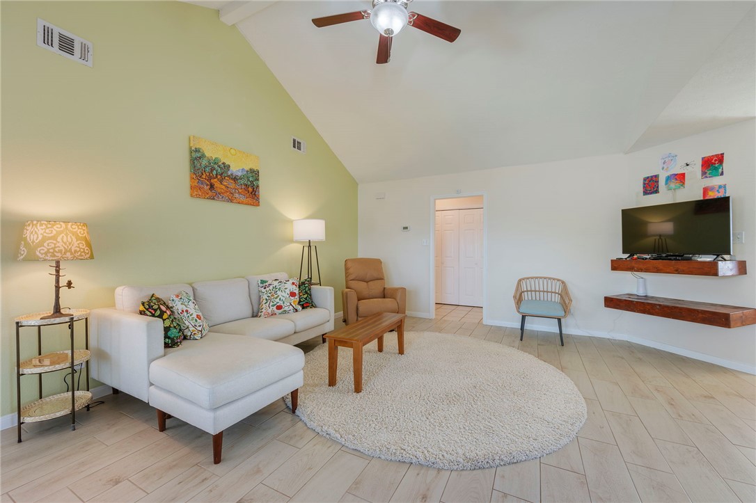 501 Riggs Street Brenham, TX 77833 - Photo 5 of 22 a living room with furniture and a flat screen tv