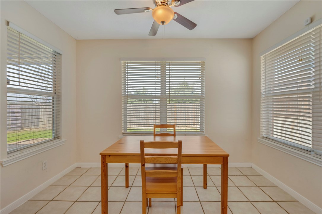 501 Riggs Street Brenham, TX 77833 - Photo 7 of 22 a view of room with window and wooden floor