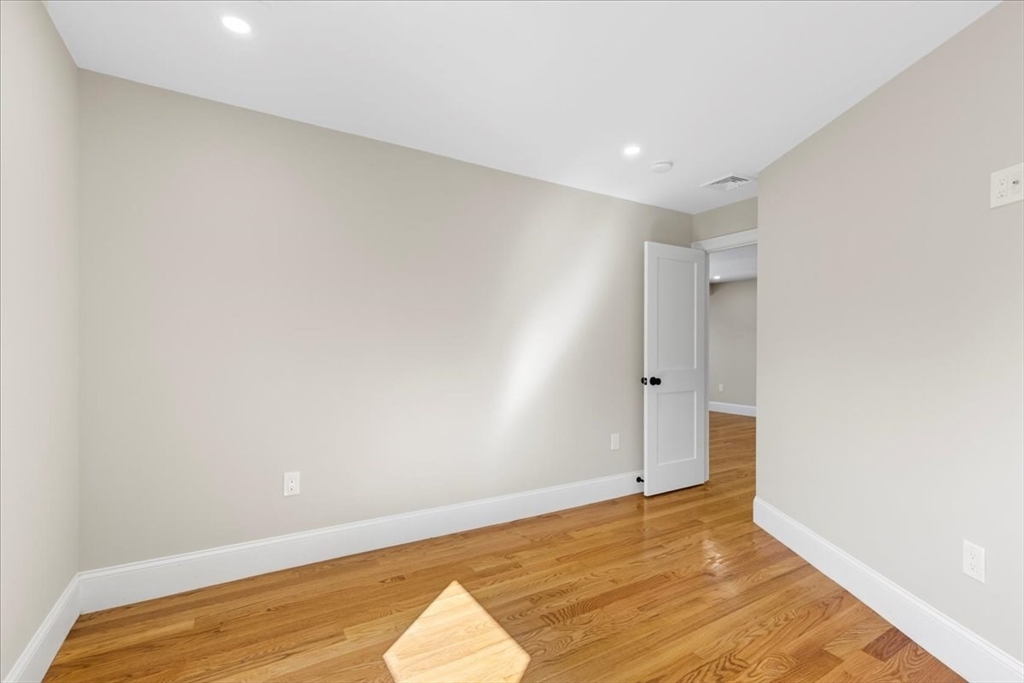 31 Woodale Avenue, Unit 3 Boston, MA 02126 - Photo 11 of 18 a view of an empty room