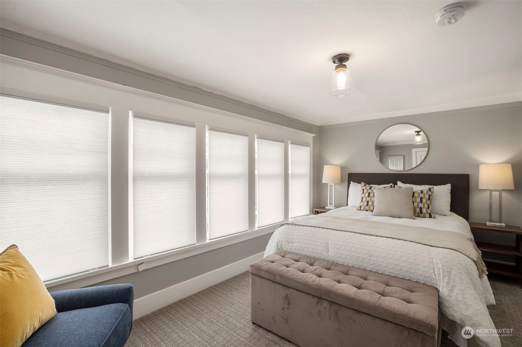 4510 2nd Avenue Northeast Seattle, WA 98105 - Photo 16 of 23 a large white bed in a bedroom next to a window
