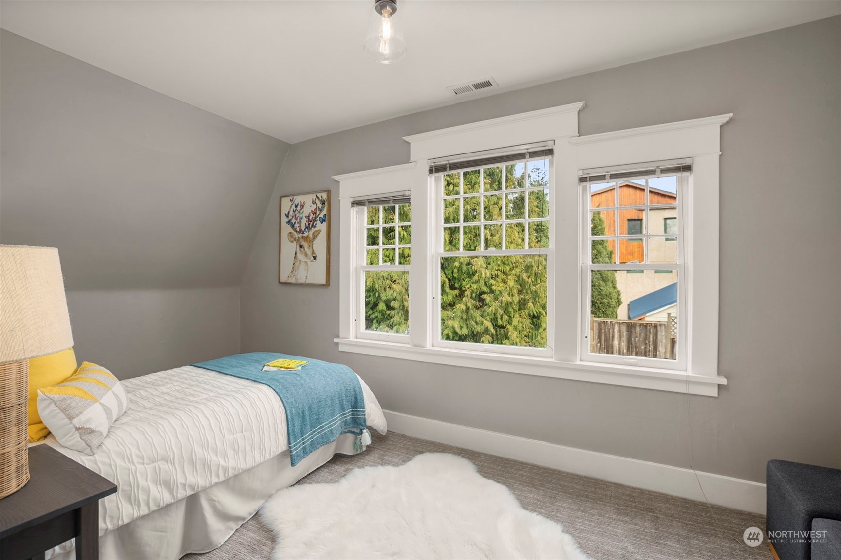 4510 2nd Avenue Northeast Seattle, WA 98105 - Photo 18 of 23 a bedroom with a bed and a window