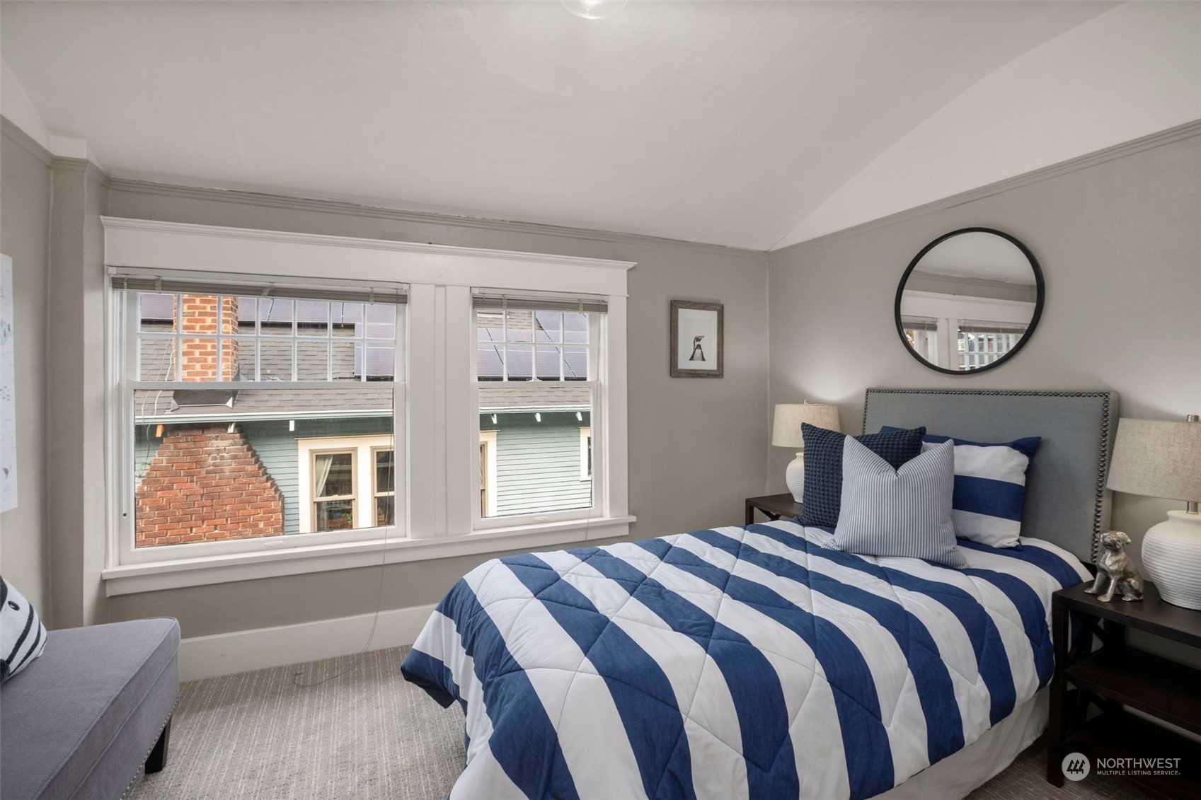 4510 2nd Avenue Northeast Seattle, WA 98105 - Photo 19 of 23 a bedroom with a large bed and a window