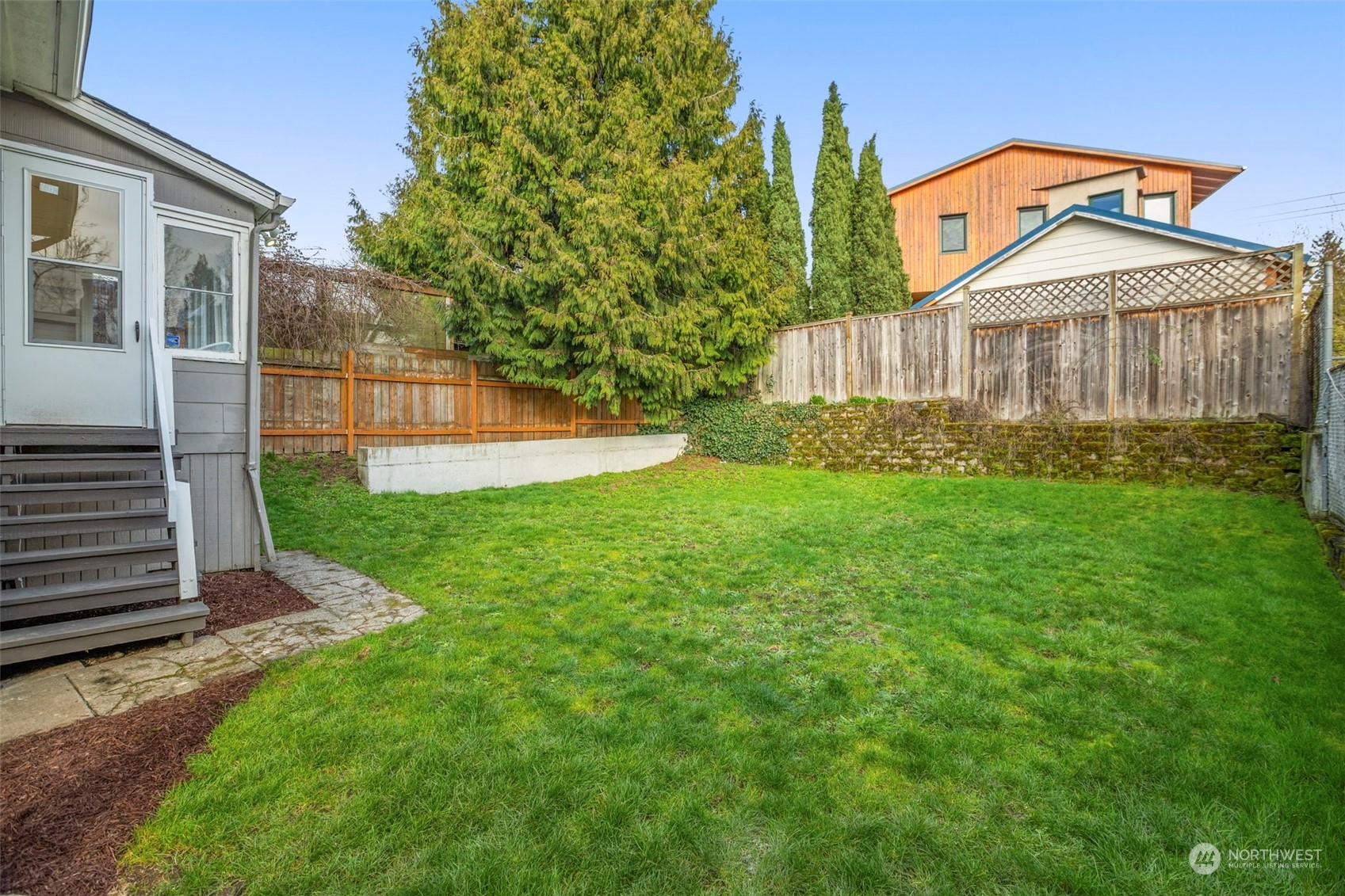 4510 2nd Avenue Northeast Seattle, WA 98105 - Photo 22 of 23 a view of a yard in front of a house