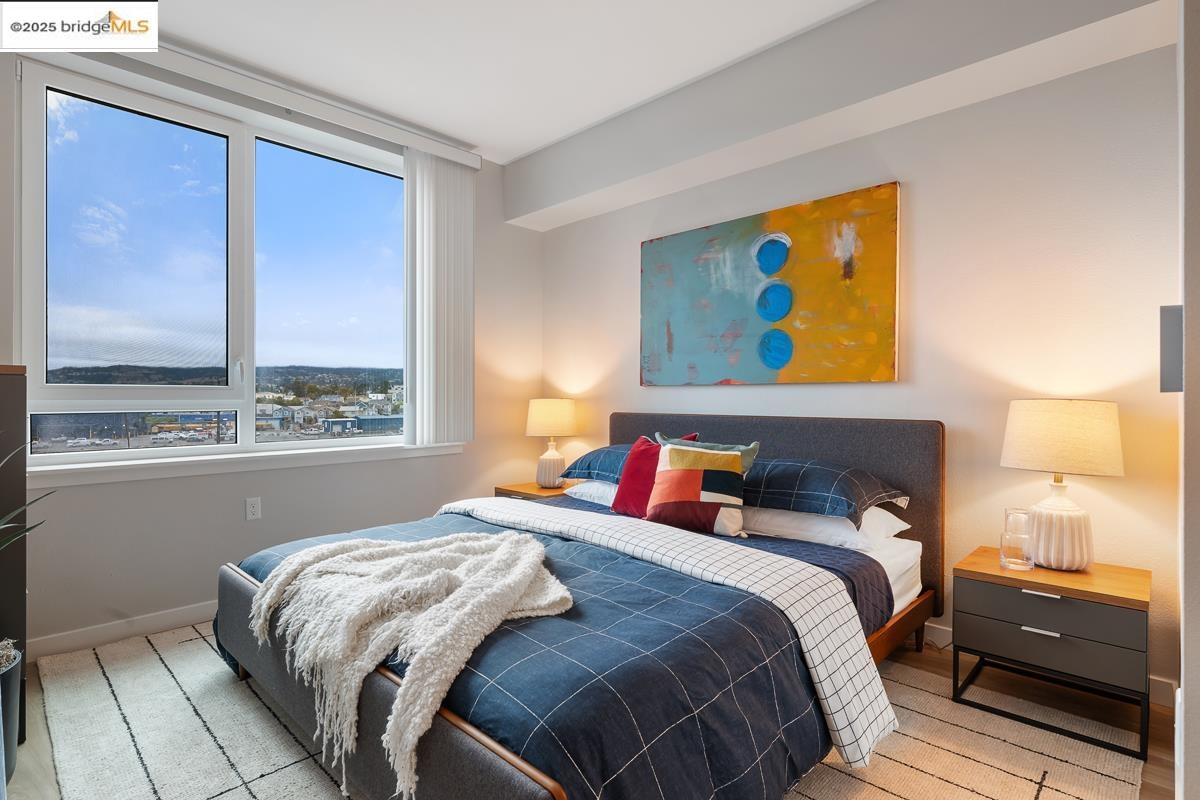 260 Brooklyn Basin Way, Unit 540 Oakland, CA 94606 - Photo 16 of 43 a bedroom with a bed and a window