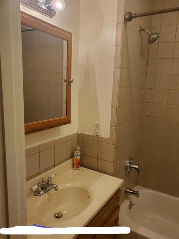 129 19th Street Brooklyn, NY 11232 - Photo 6 of 8 a bathroom with a sink and a mirror