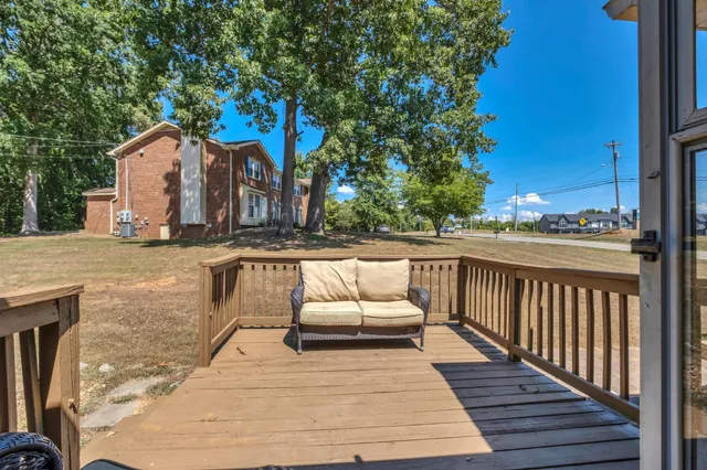 a view of a balcony with furniture