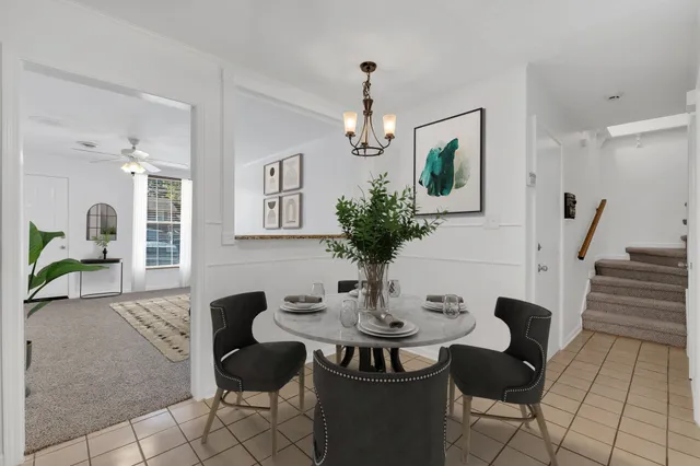 a view of a livingroom with furniture and a potted plant