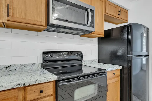 a kitchen with a stove and a microwave