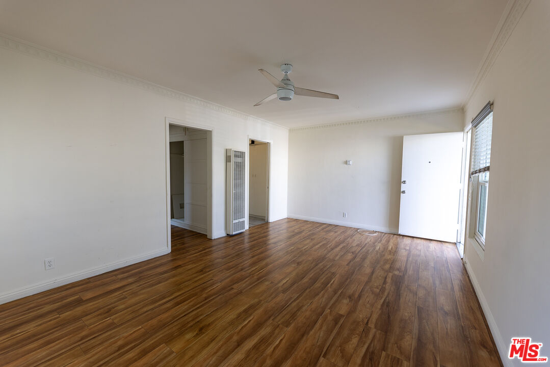 4119 Marlton Avenue, Unit 1 Los Angeles, CA 90008 - Photo 5 of 13 a view of an empty room with wooden floor and a window