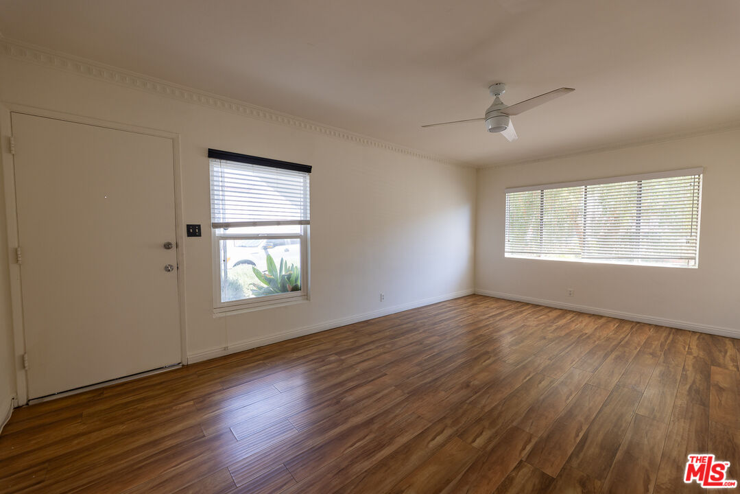 4119 Marlton Avenue, Unit 1 Los Angeles, CA 90008 - Photo 6 of 13 a view of an empty room with wooden floor and a window