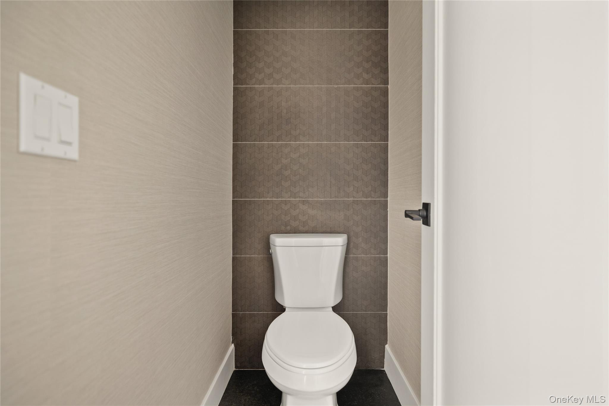 3 Valley Way, Unit 320 Spring Valley, NY 10977 - Photo 22 of 41 Bathroom with toilet and tile walls