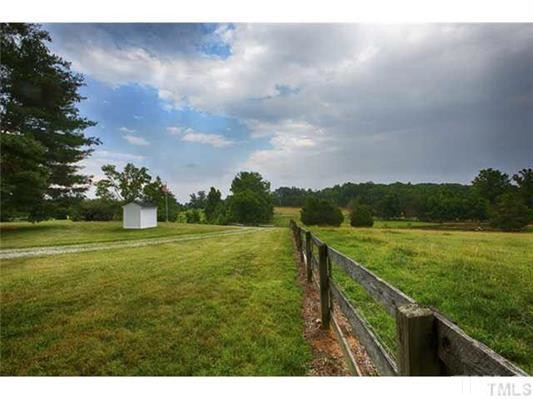 9123 South Lowell Road Bahama, NC 27503 - Photo 22 of 25 This view of the pastures is seen from the sunroom and kitchen windows and looks toward (the left) to South Lowell Road and the pond. View of Pastures