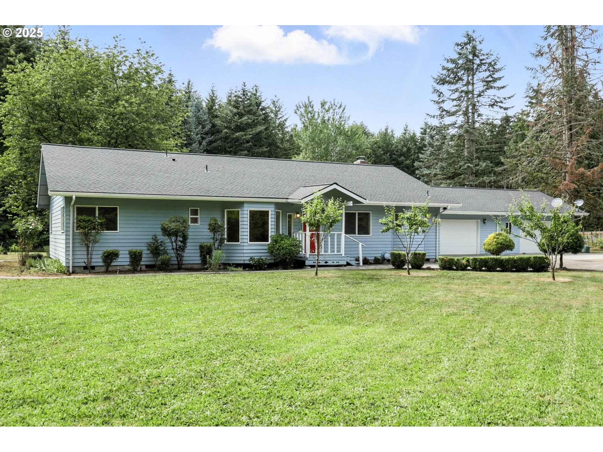 116 Noble Road Winlock, WA 98596 - Photo 1 of 48 a front view of a house with a garden
