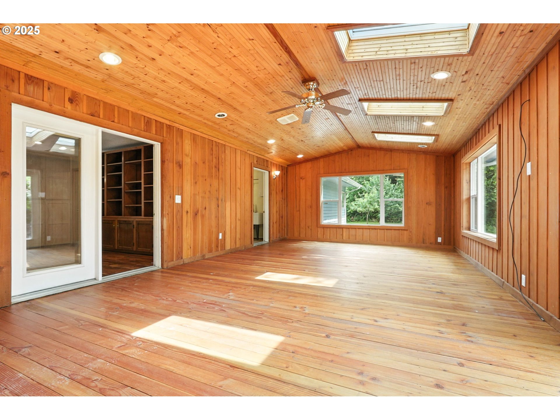 116 Noble Road Winlock, WA 98596 - Photo 20 of 48 a view of an empty room with wooden floor and a window