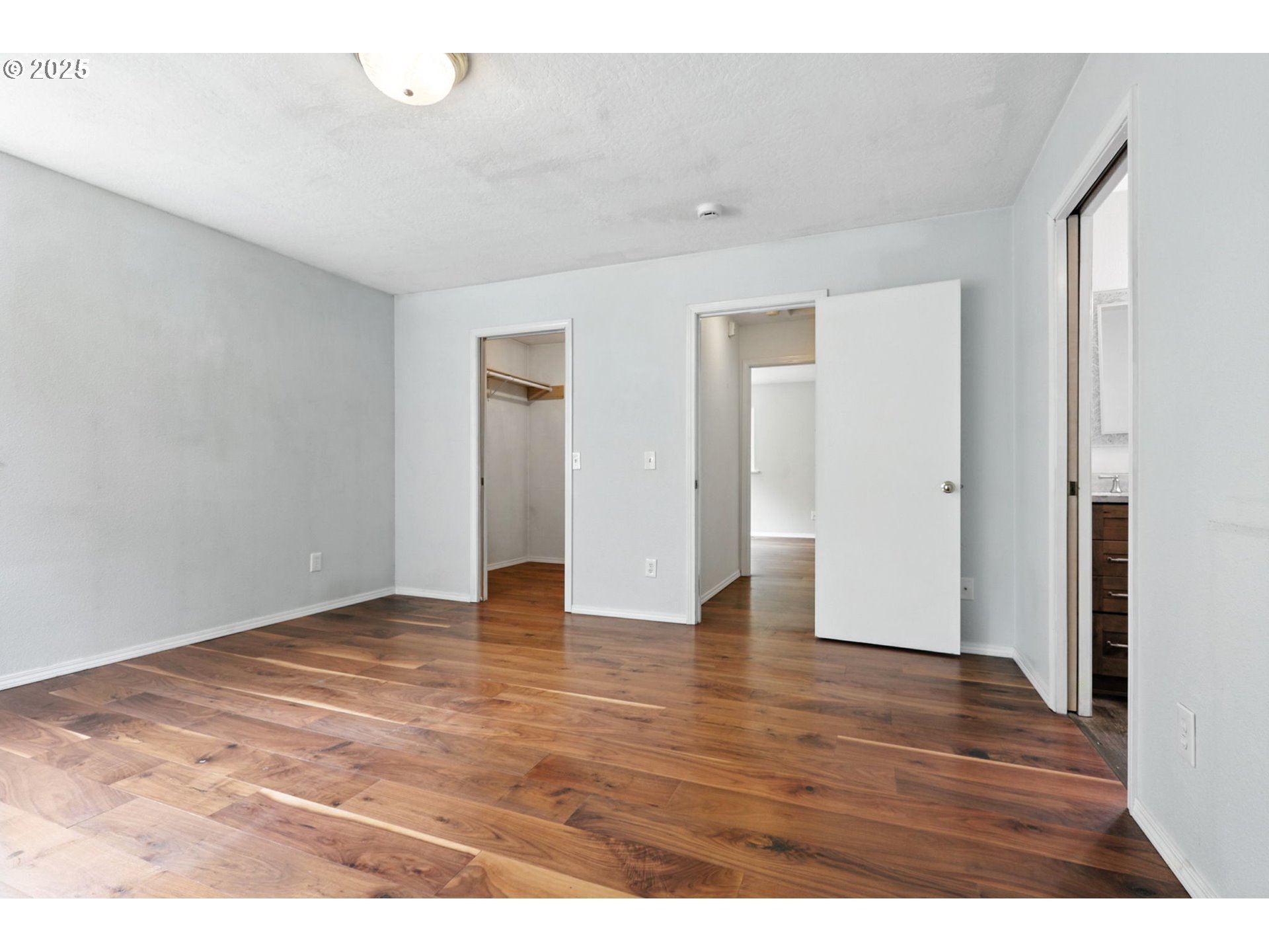 116 Noble Road Winlock, WA 98596 - Photo 22 of 48 a view of an empty room with wooden floor