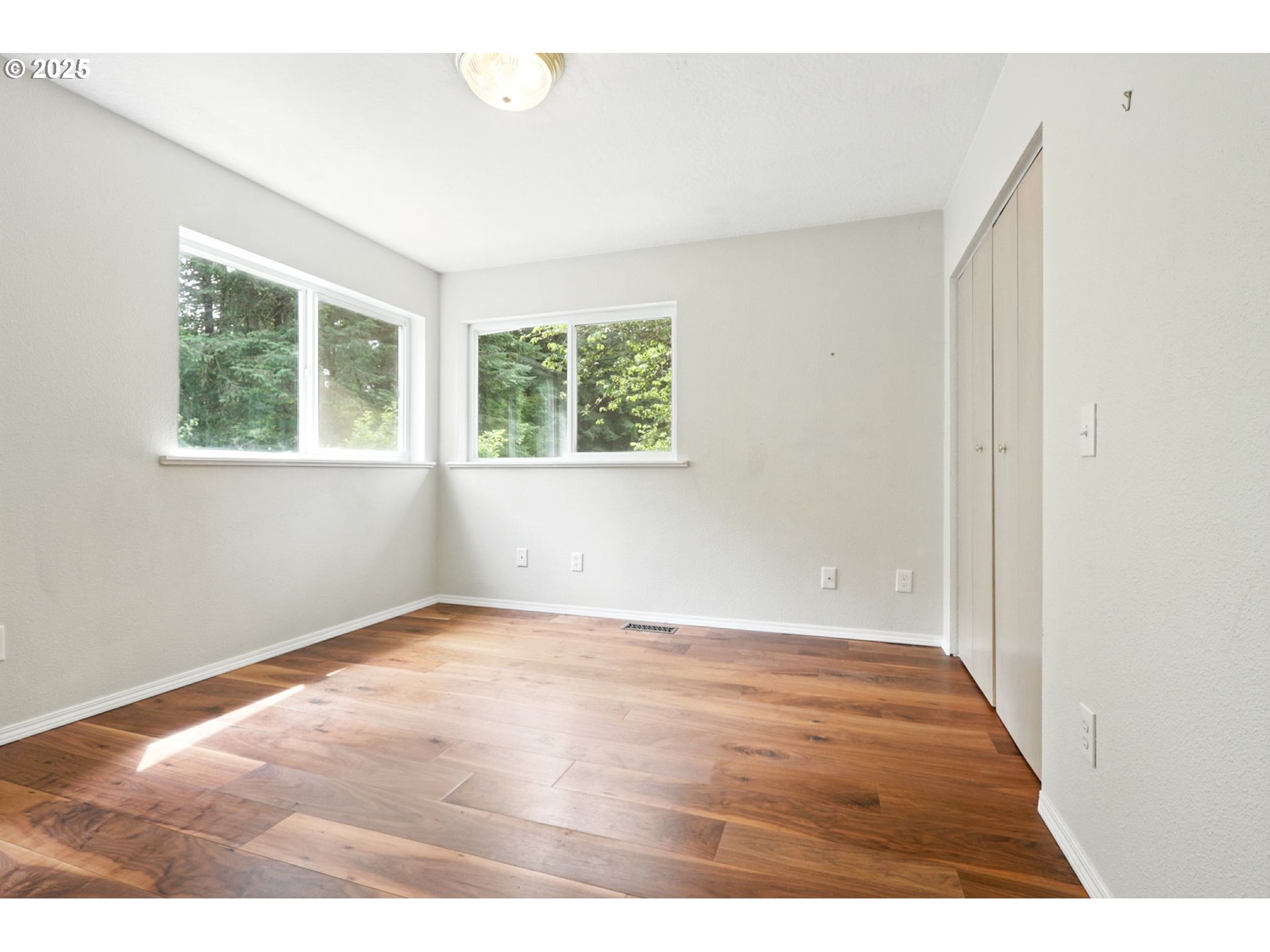 116 Noble Road Winlock, WA 98596 - Photo 26 of 48 an empty room with wooden floor and windows