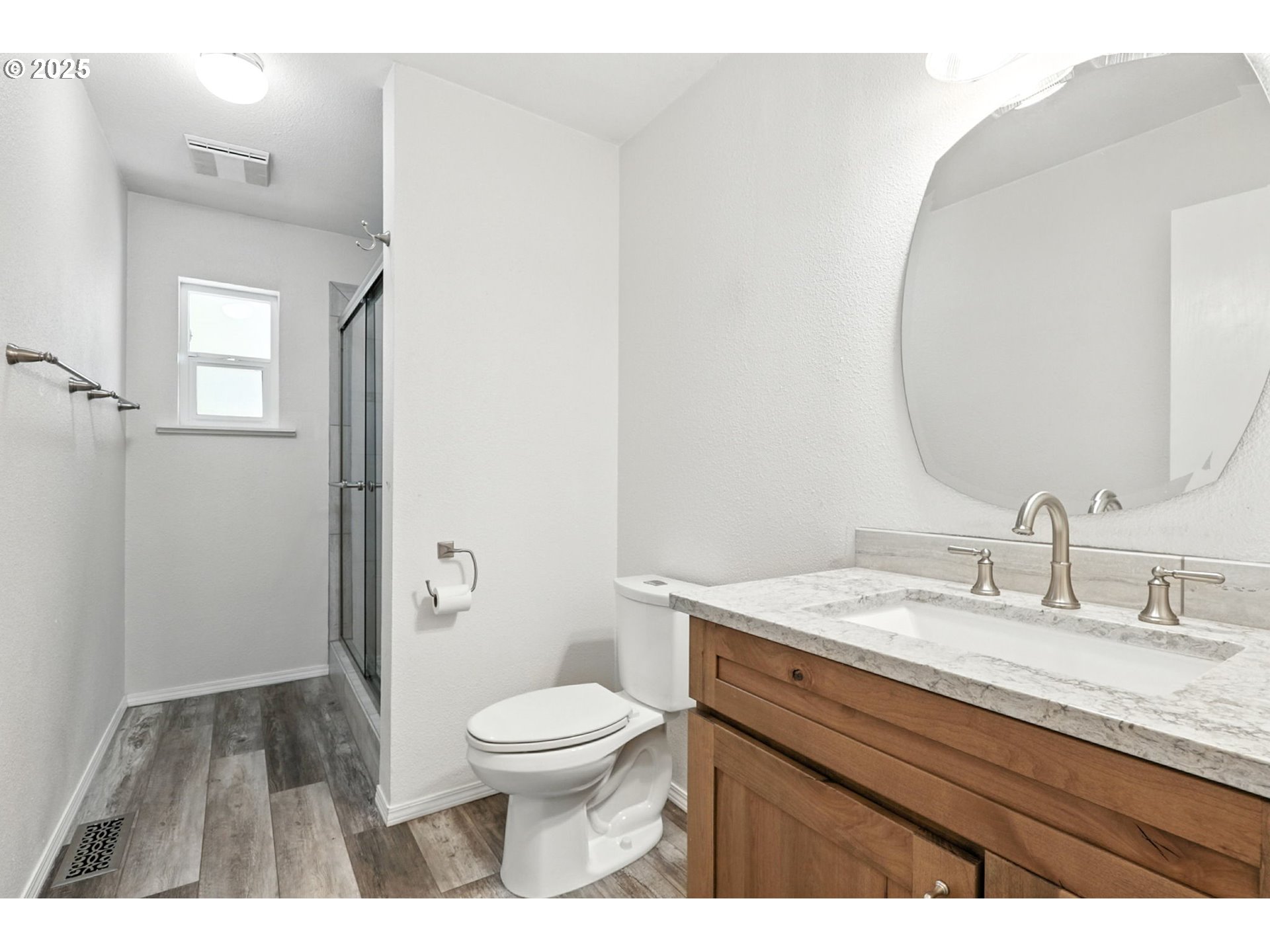 116 Noble Road Winlock, WA 98596 - Photo 27 of 48 a bathroom with a granite countertop sink a toilet and a mirror
