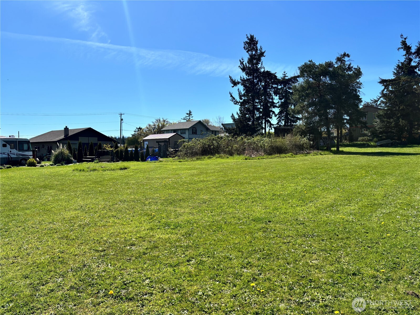 0 29th Street Port Townsend, WA 98368 - Photo 4 of 7 a view of a field with an trees in the background