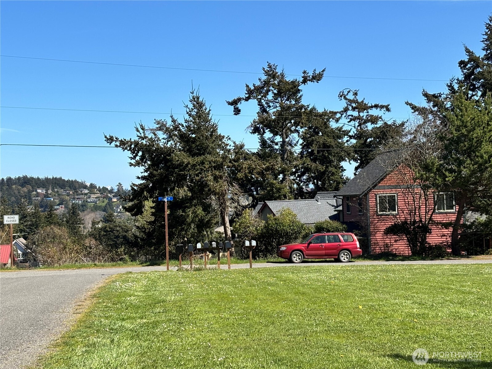 0 29th Street Port Townsend, WA 98368 - Photo 7 of 7 a view of a yard with a car parked in front of it